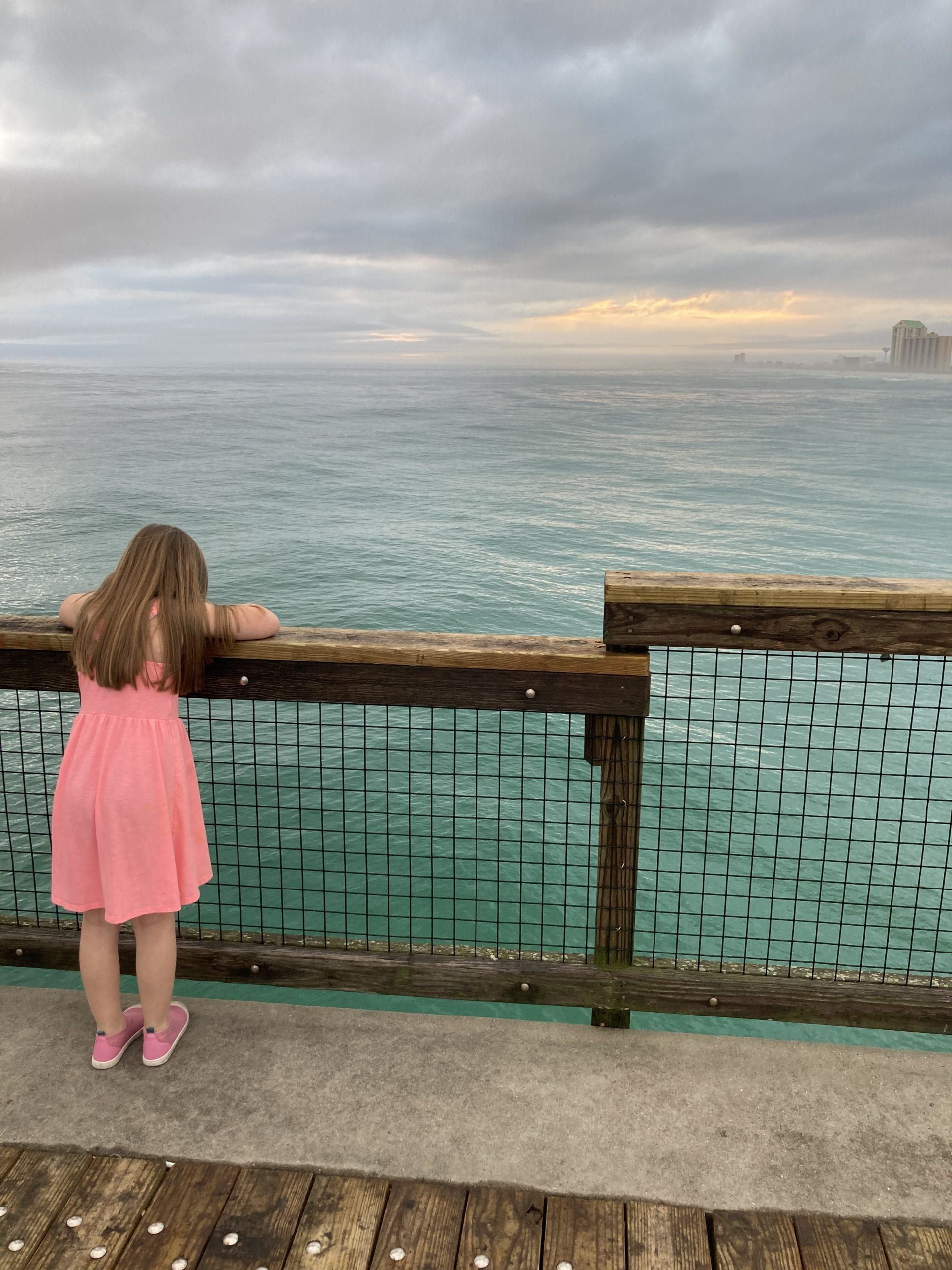 It's Friday Navarre!
Rain is in the forecast so grab your umbrella as you head out the door. Enjoy today's Photo of the Day, which displays the the wonder of a child on Navarre Beach Fishing Pier, submitted by Nicole Shaddix-Olsen.