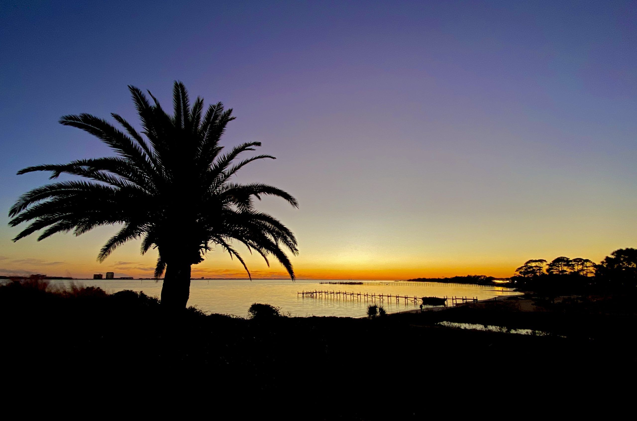 Today's Photo of the Day comes from Gary Sturdivant, who took this photo of the sun setting from the foot of the Navarre Beach Bridge.