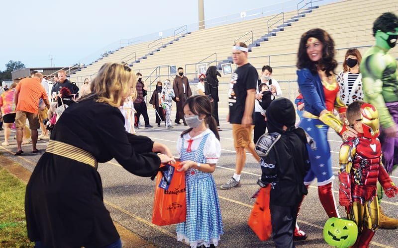 Photos by Kaitie Meyer Nearly 2,000 people came to trick or treat and support local businesses at the Gulf Breeze High School stadium for BargeOween Oct. 31.