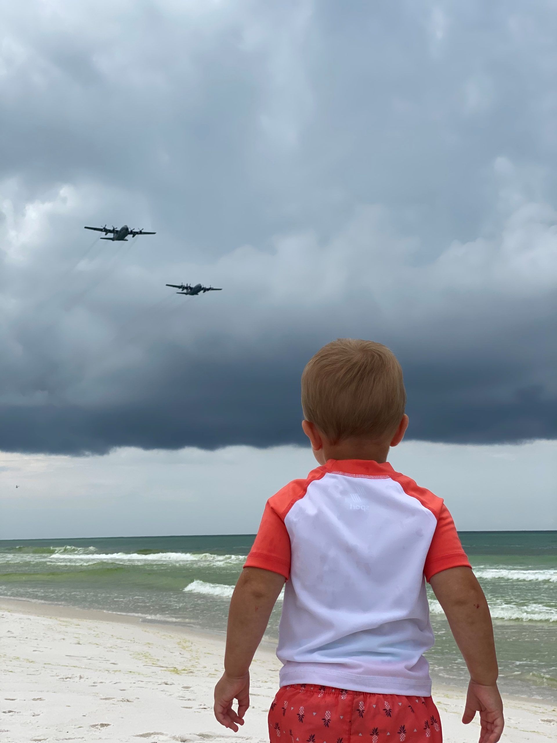 Cash watching as the planes fly over Navarre beach. Photo taken by Dean Bourgeois
