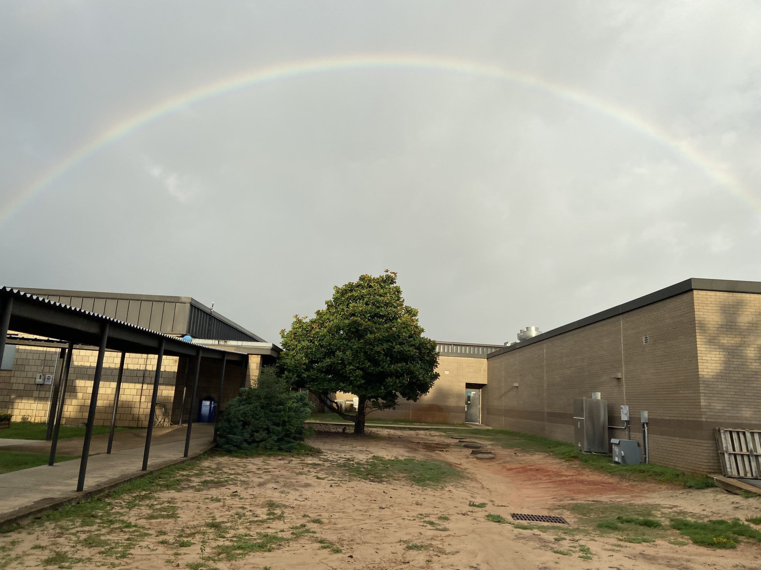 Today's Photo of the Day comes from Michelle Hatcher, who took this photo of a massive rainbow after dropping her daughter off at Holley-Navarre Intermediate School on Monday.