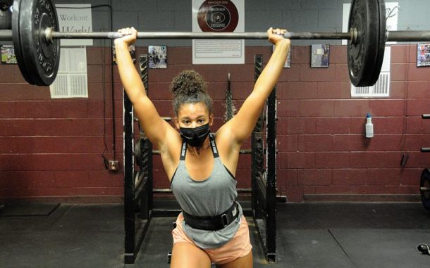 Jada Thomas gets a rep in during a weightlifting workout. She is one of Navarre’s returning lifters from last season.