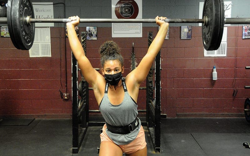 Jada Thomas gets a rep in during a weightlifting workout. She is one of Navarre&rsquo;s returning lifters from last season.