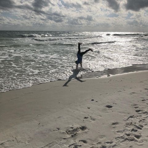 Can you believe it's already THE LAST DAY OF FEBRUARY?
Since this year we won't have a leap day, we thought it was only appropriate to feature this cartwheel on the beach as Photo of the Day. This picture was taken by Monica Jackson Houchins of her playful granddaughter Elly.