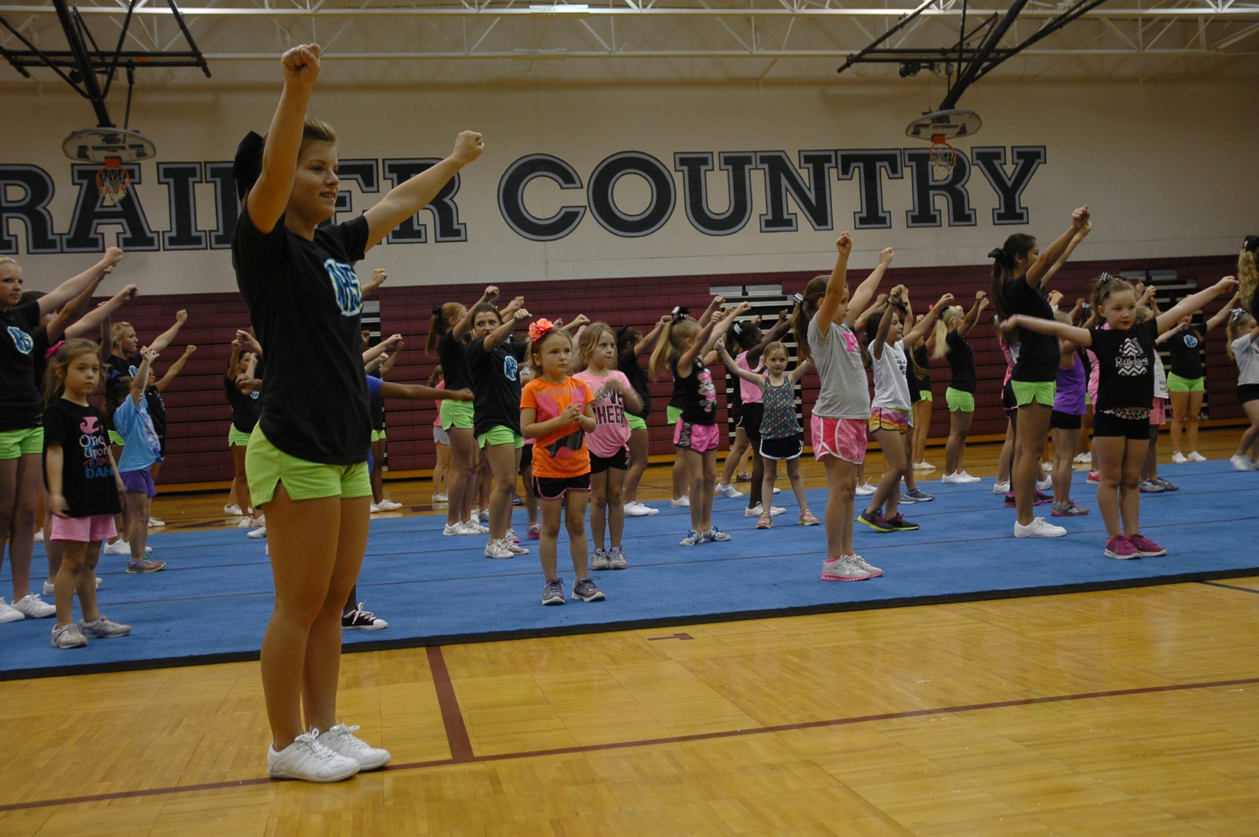 NHS cheer team mentors younger cheerleaders | Navarre Press