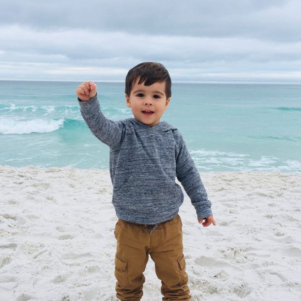 Little Boy Holding Shell